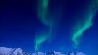 A Brilliant Glimpse of the Aurora Borealis Dancing in the Sky Near the North Pole